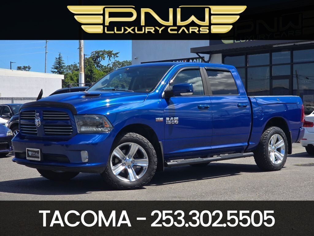 2015 RAM 1500 Sport in Blue Streak Pearlcoat — front three-quarter view