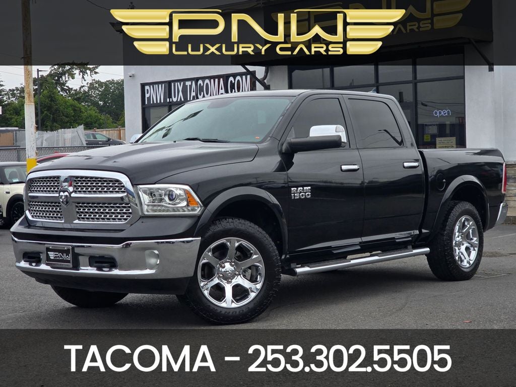 2017 RAM 1500 Laramie in Brilliant Black Crystal Pearlcoat — front three-quarter view