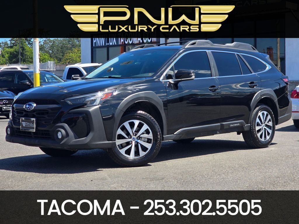 2024 Subaru Outback Premium in Crystal Black Silica — front three-quarter view